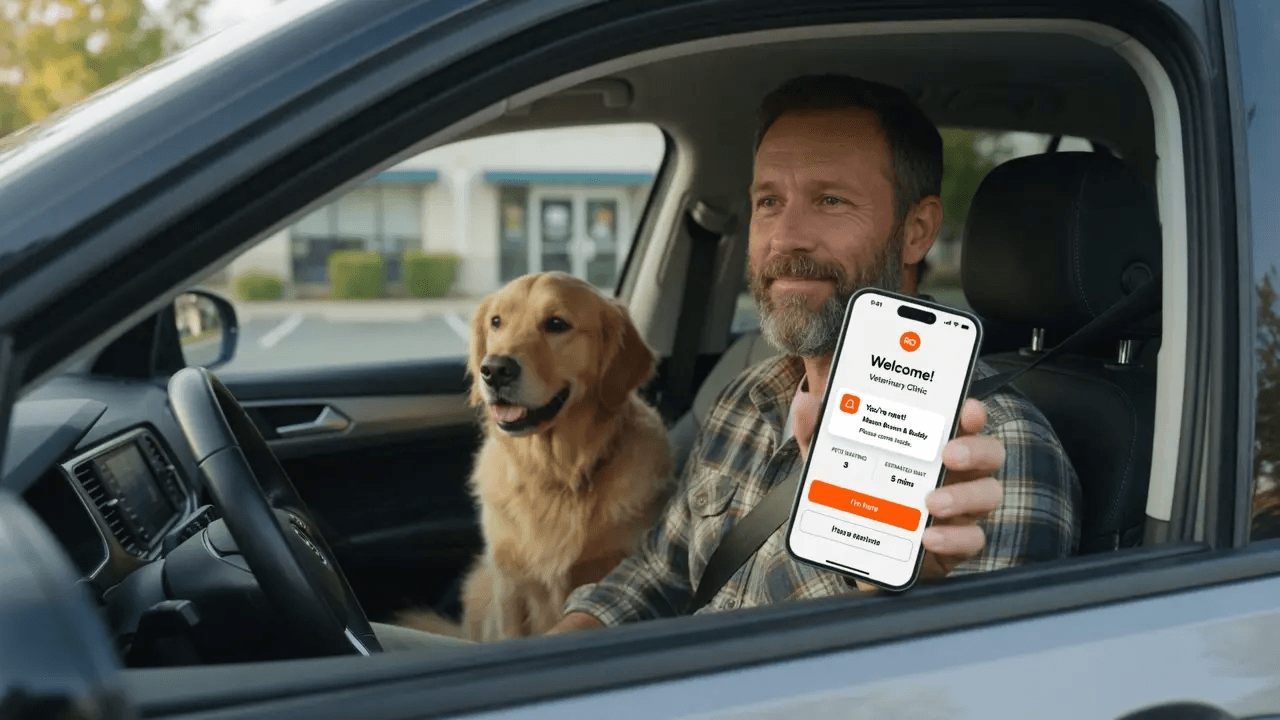 Owner waiting in their car with a dog, phone showing they're next in line at the vet